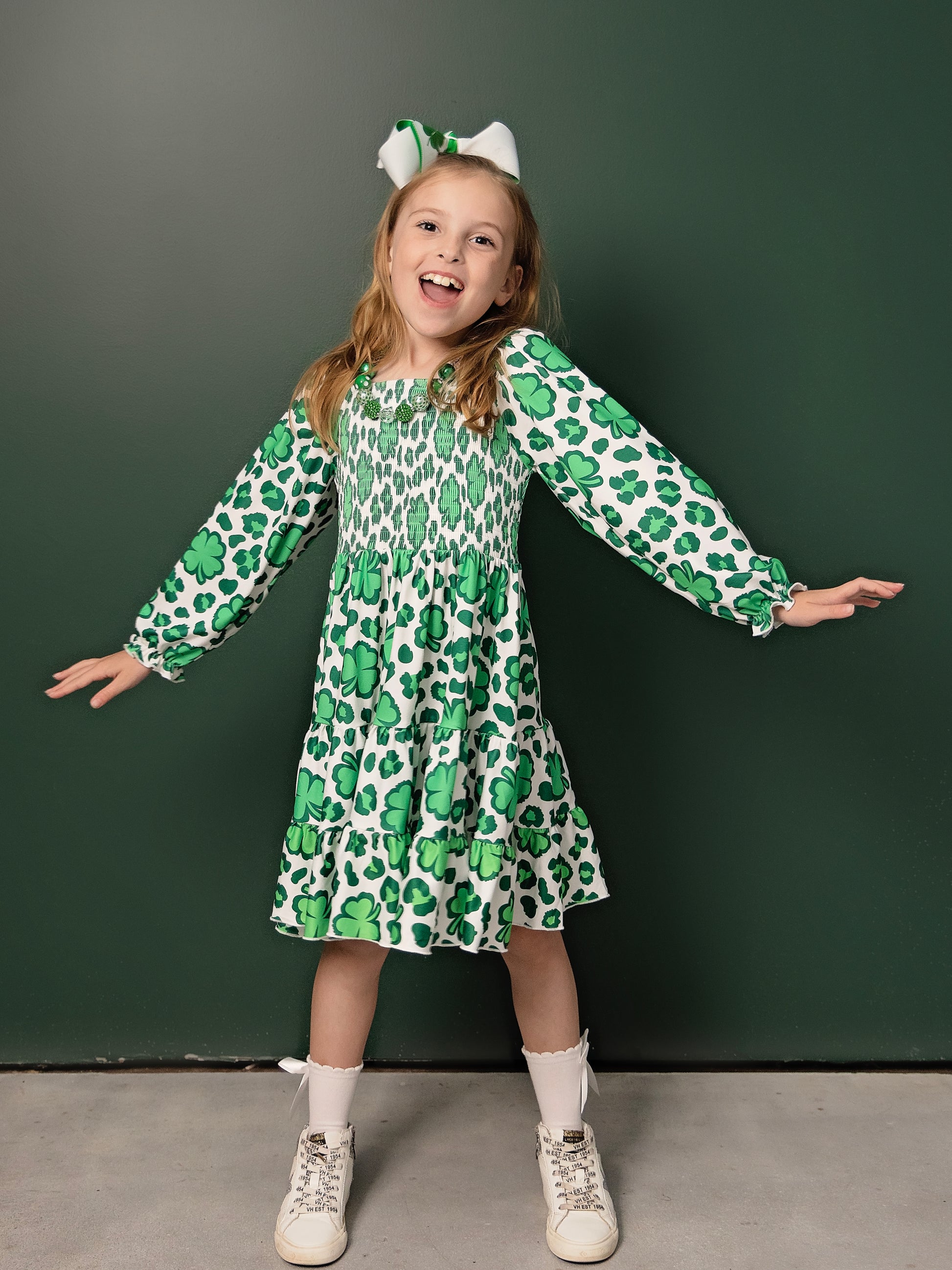 Lucky Clovers Smocked Twirl Dress on a model