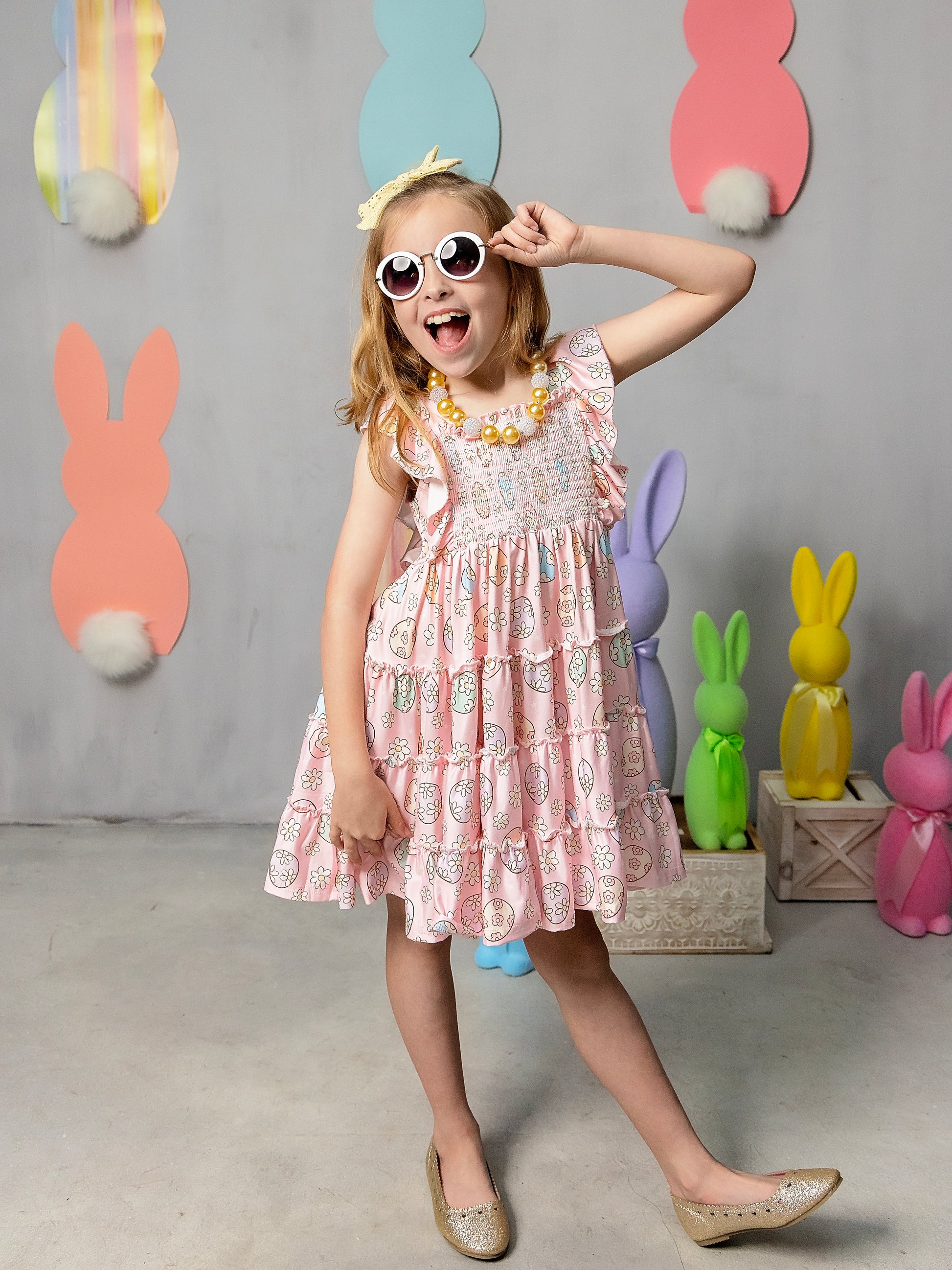 Classic Easter Eggs Ruffled Apron Dress on a model