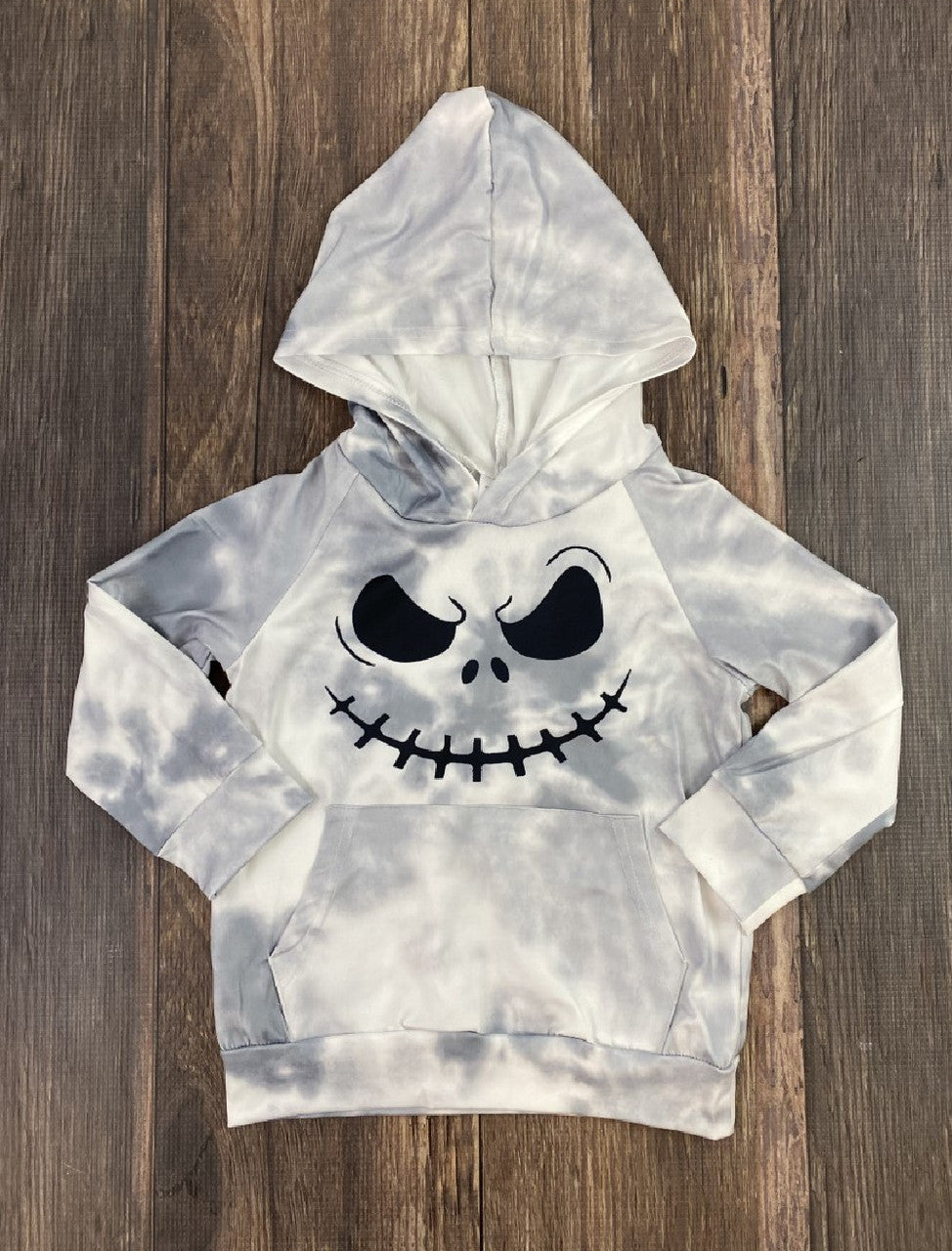 Gray and white hoodie with Jack Skellington printed on the front.