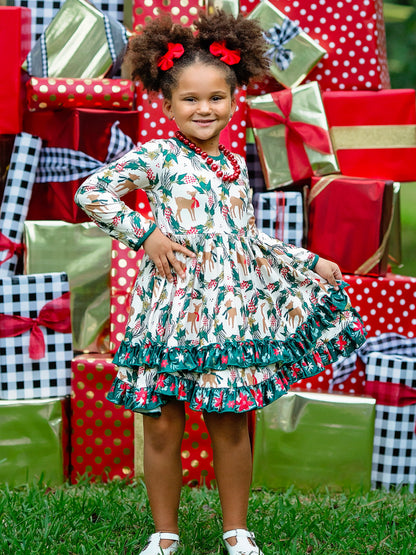 Double ruffle Christmas deer print long sleeve twirl dress on a young girl.