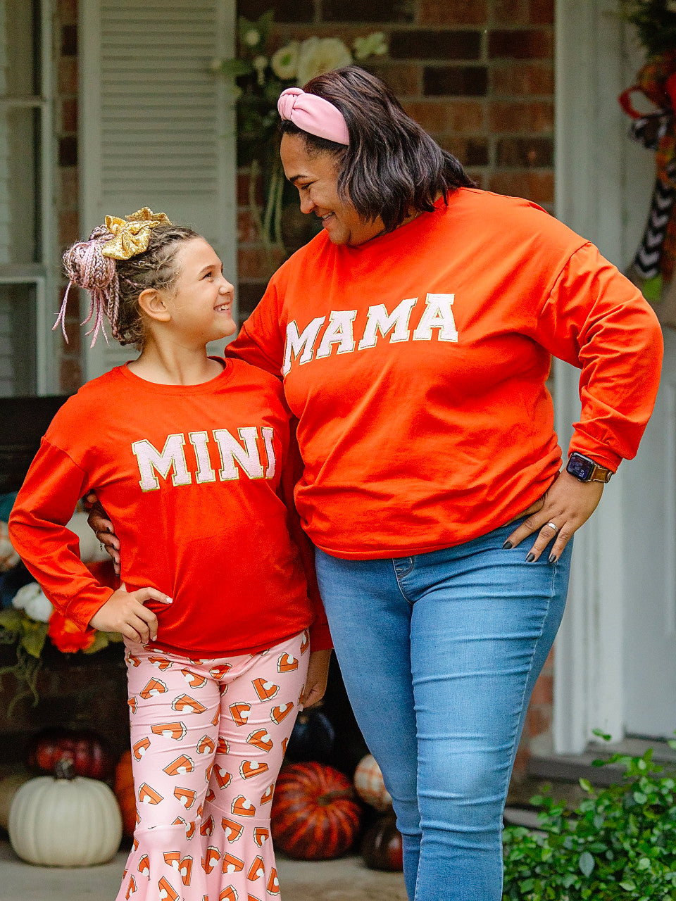 Mama and Mini Orange fall shirts on a mom and daughter.