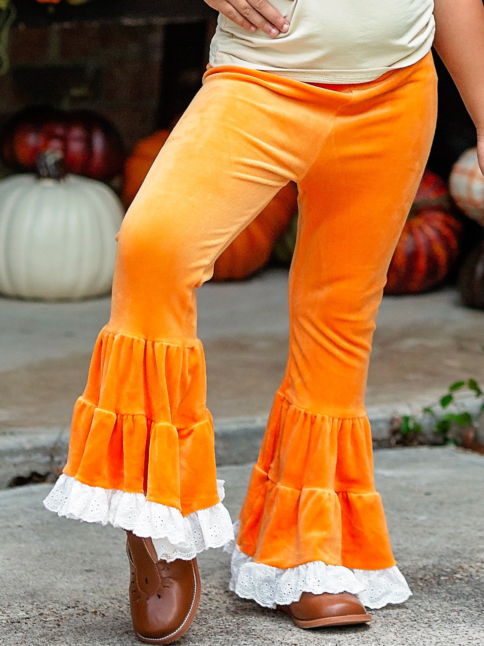 Orange Velvet Bell Pants on a little girl.