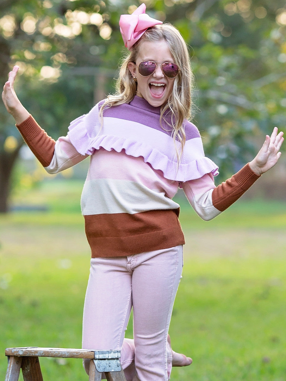 Lavender Haze striped sweater on a preteen female model.