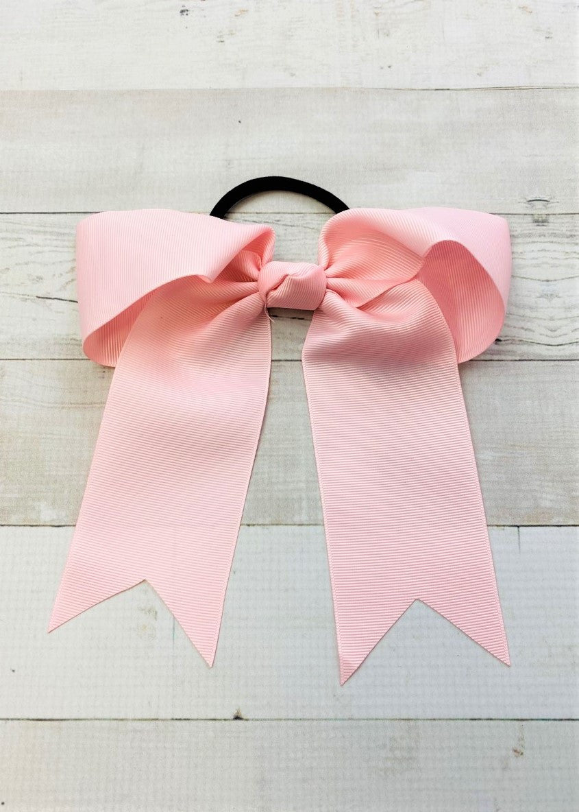 Light pink cheer bow with ponytail elastic