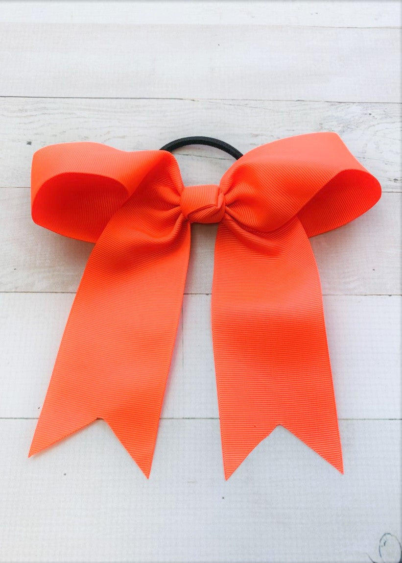 Neon orange cheer bow with ponytail elastic