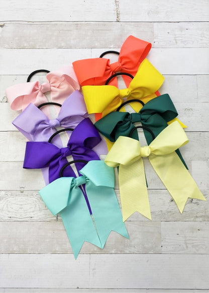 Colorful cheer bows with ponytail ties