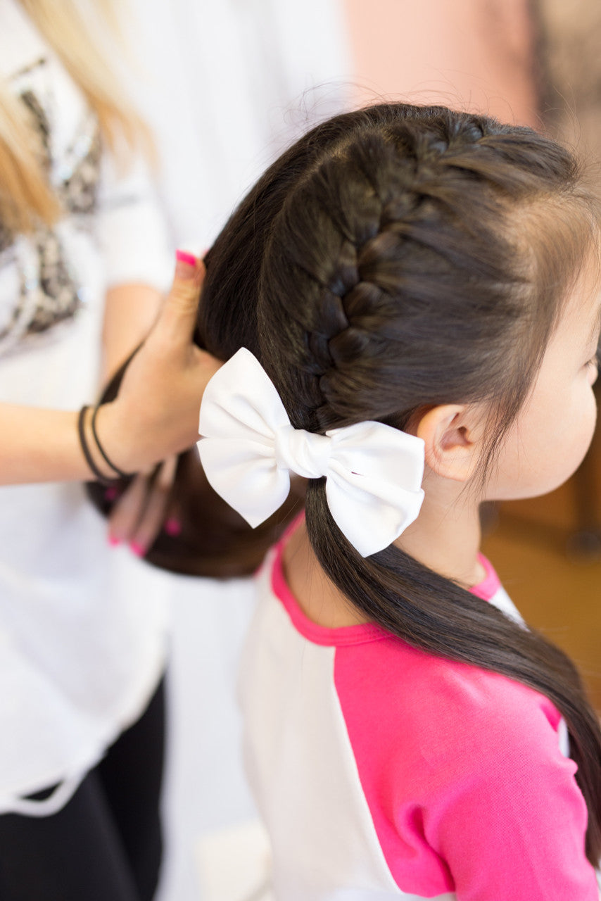 Satin Hair Bow in Ivory on a model