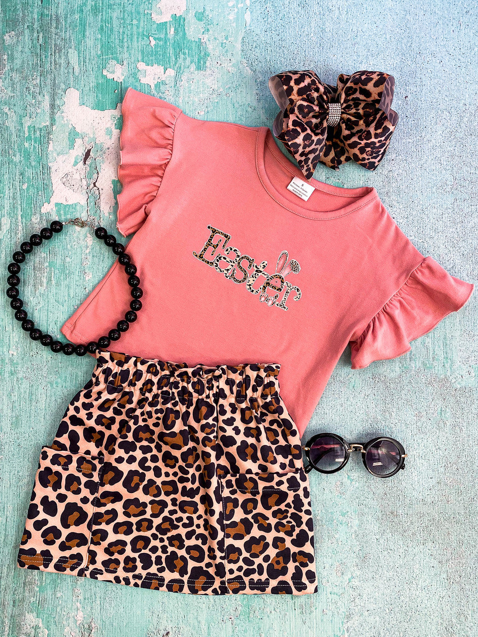 Dusty rose flutter short sleeve top and "Easter" with animal print lettering paired with animal print two pocket skirt.