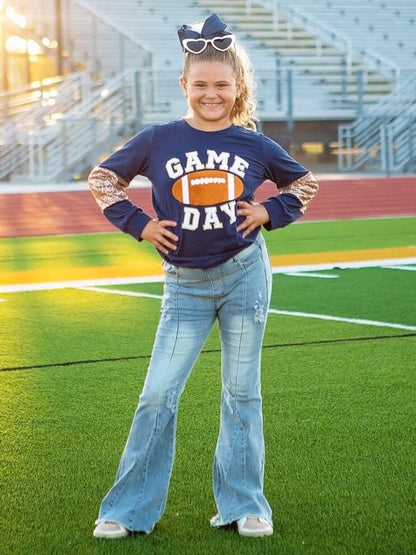 Girls navy game day top on model