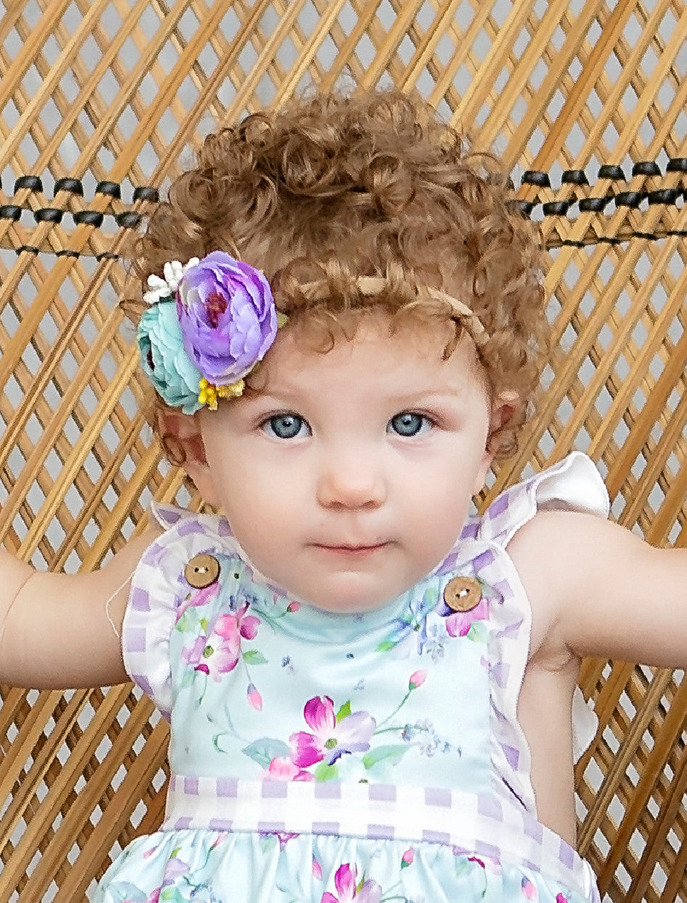 Cabbage rose headband on model.