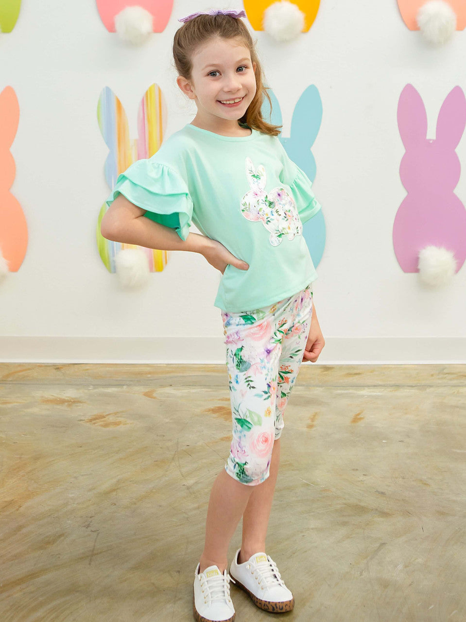 Mint ruffle sleeve top with a floral bunny applique, paired with coordinating floral capri leggings on Model.