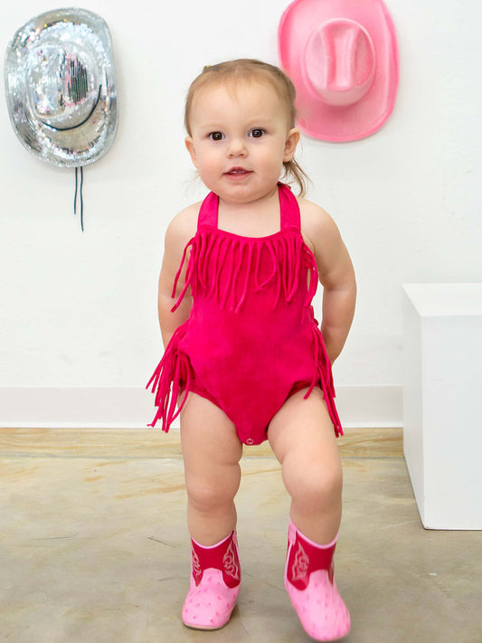 hot pink fringe and halter tie baby romper on model