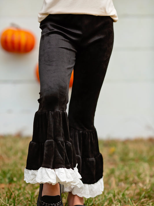 Black Lace Trimmed Velvet Leggings on a model