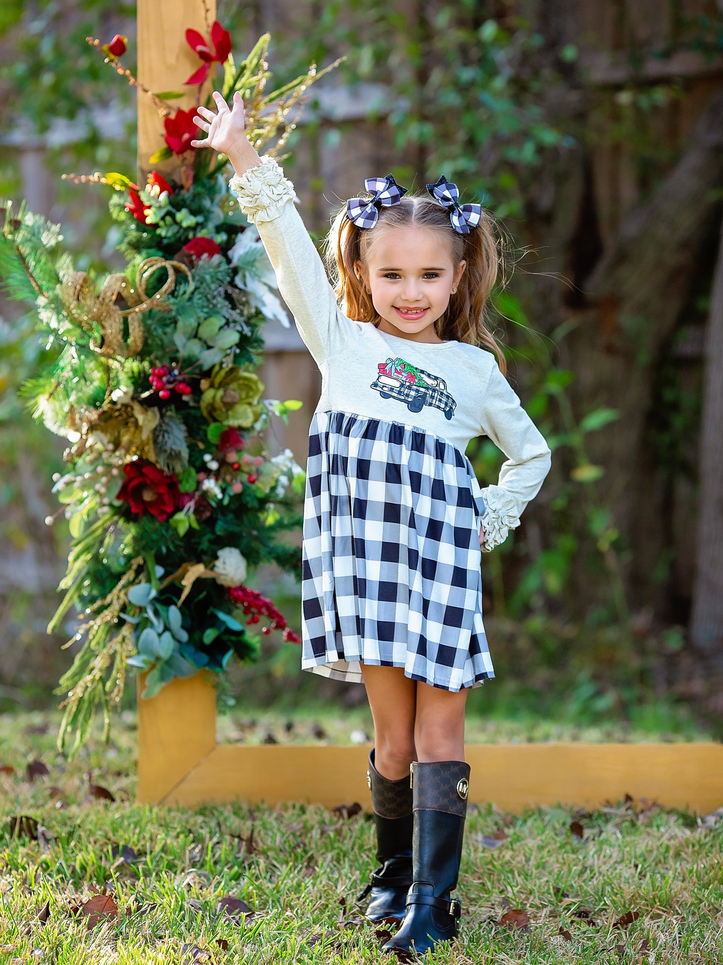 Christmas Tree Black Gingham Truck Dress on a model