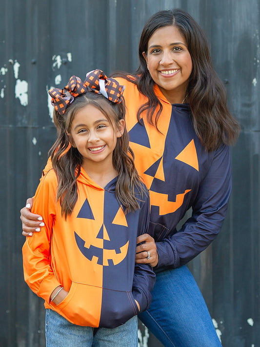 Mom and me models wearing jack-o-lantern hoodie