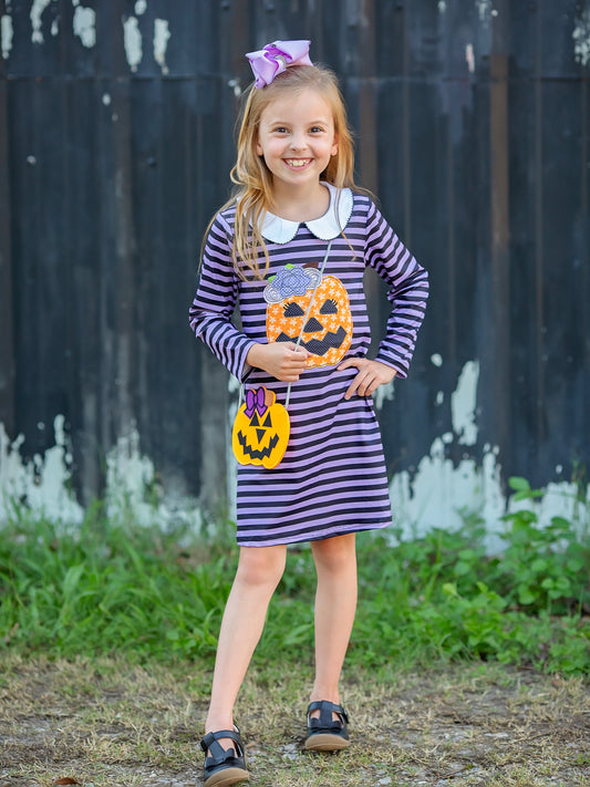 striped jack-o-latern halloween dress on a model