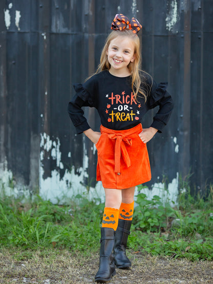 trick or treat black long sleeve shirt with orange tie skirt outfit on model