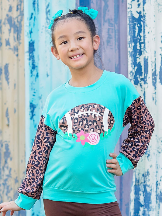 wild about football animal print & blue top on a model