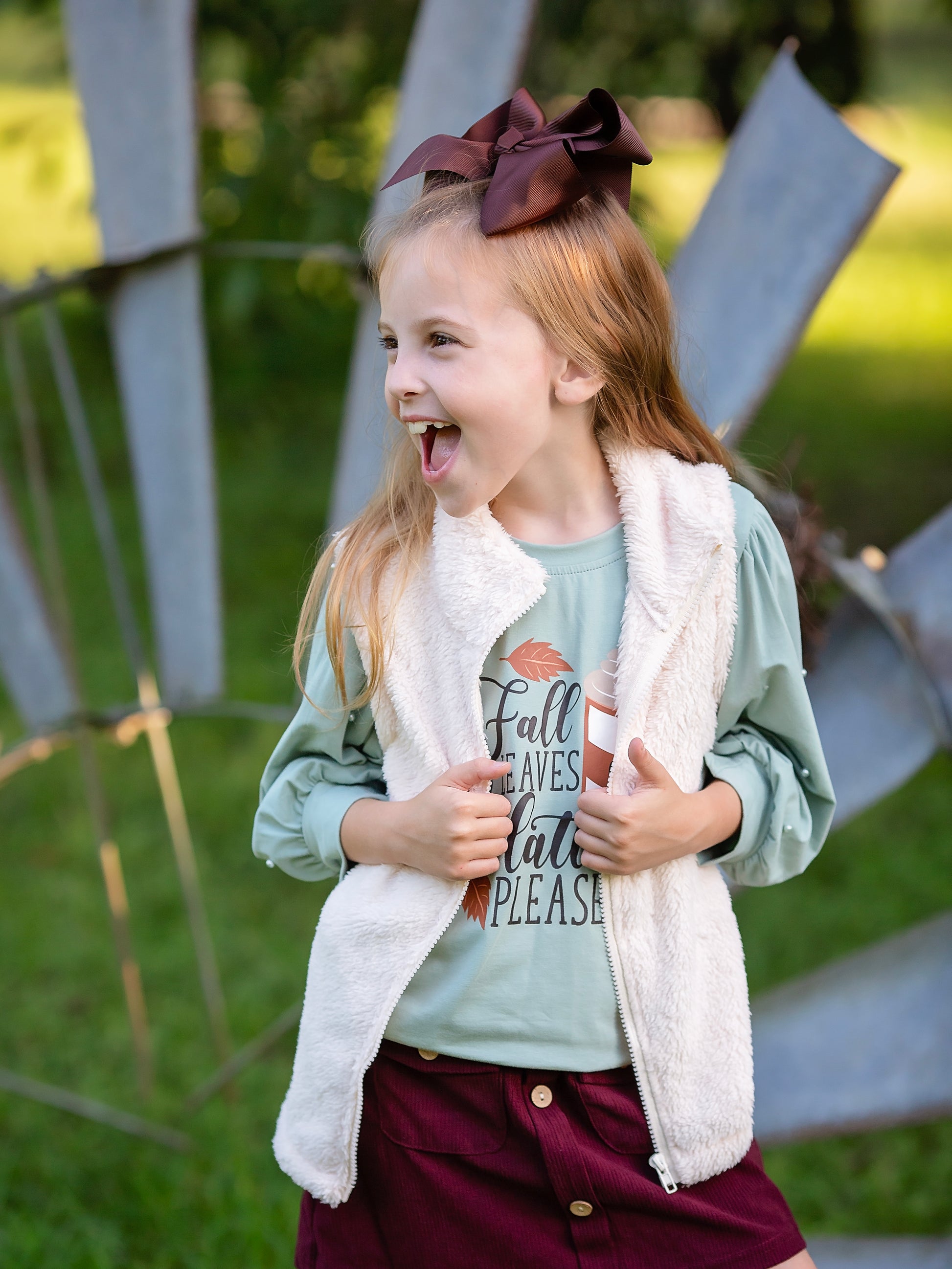 cream sherpa vest with a zipper on a model