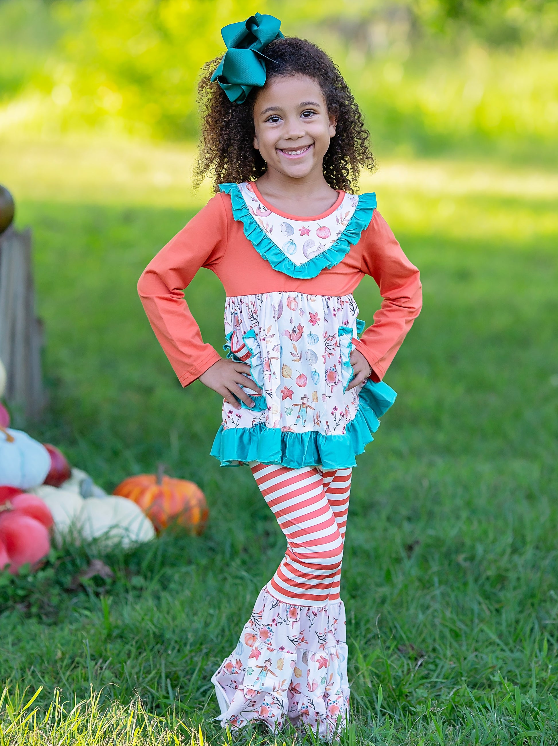 Fall Pumpkins Ruffled top & pants set on a model