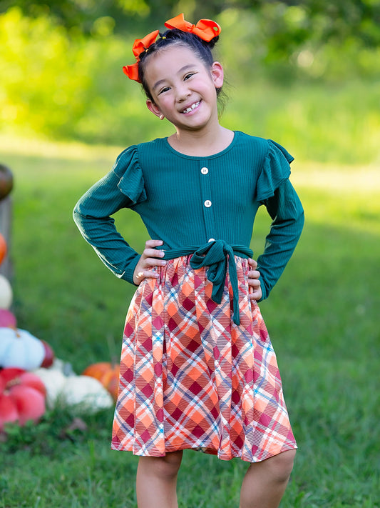 Green & Plaid Ruffled Tie Twirl Dress on a model