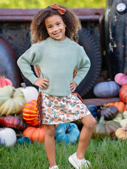 Green Sweater & Pumpkin Fringe Skirt Set on a model