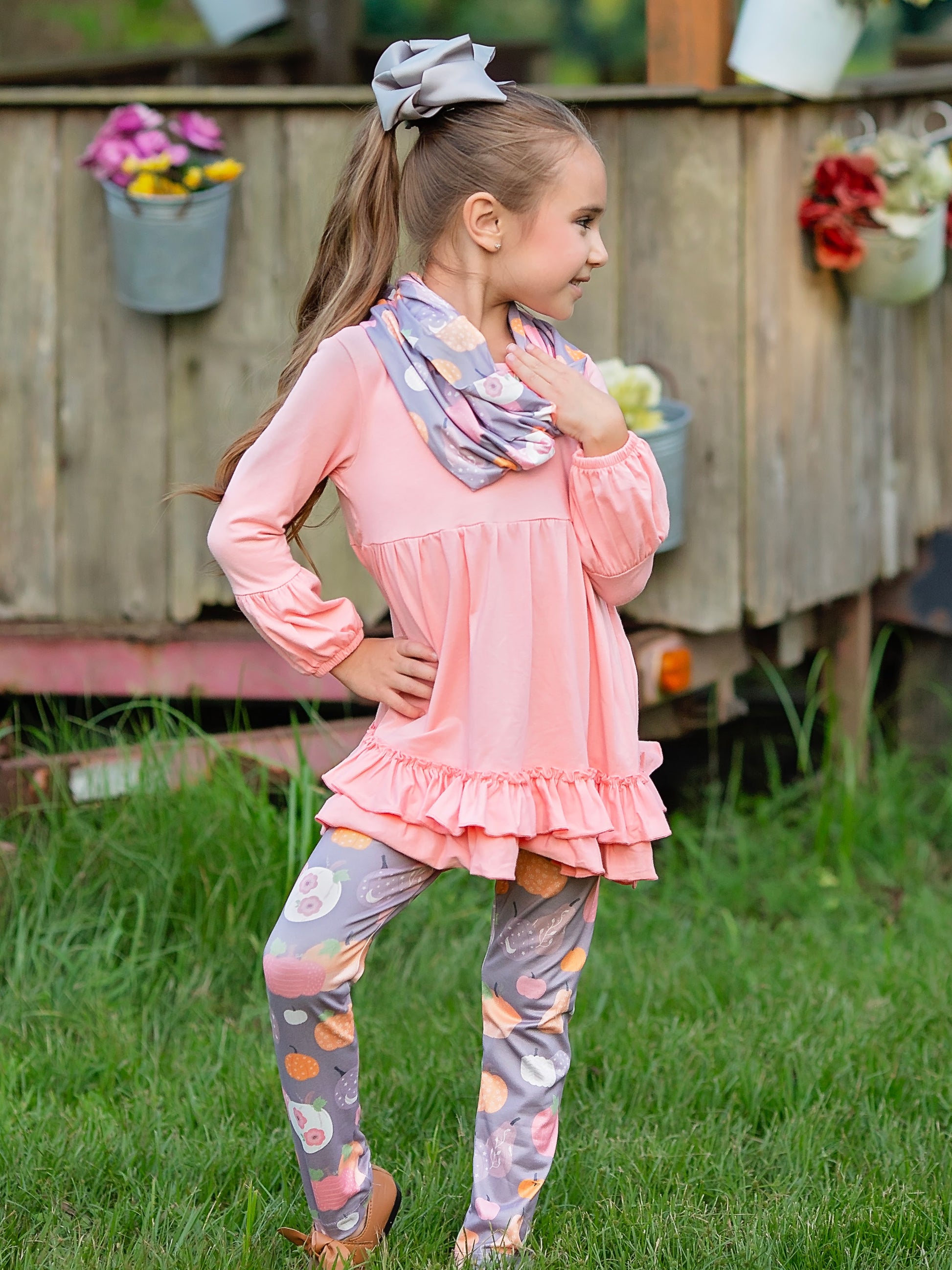 pink long sleeve with grey pumpkin leggings and scarf outfit on a model