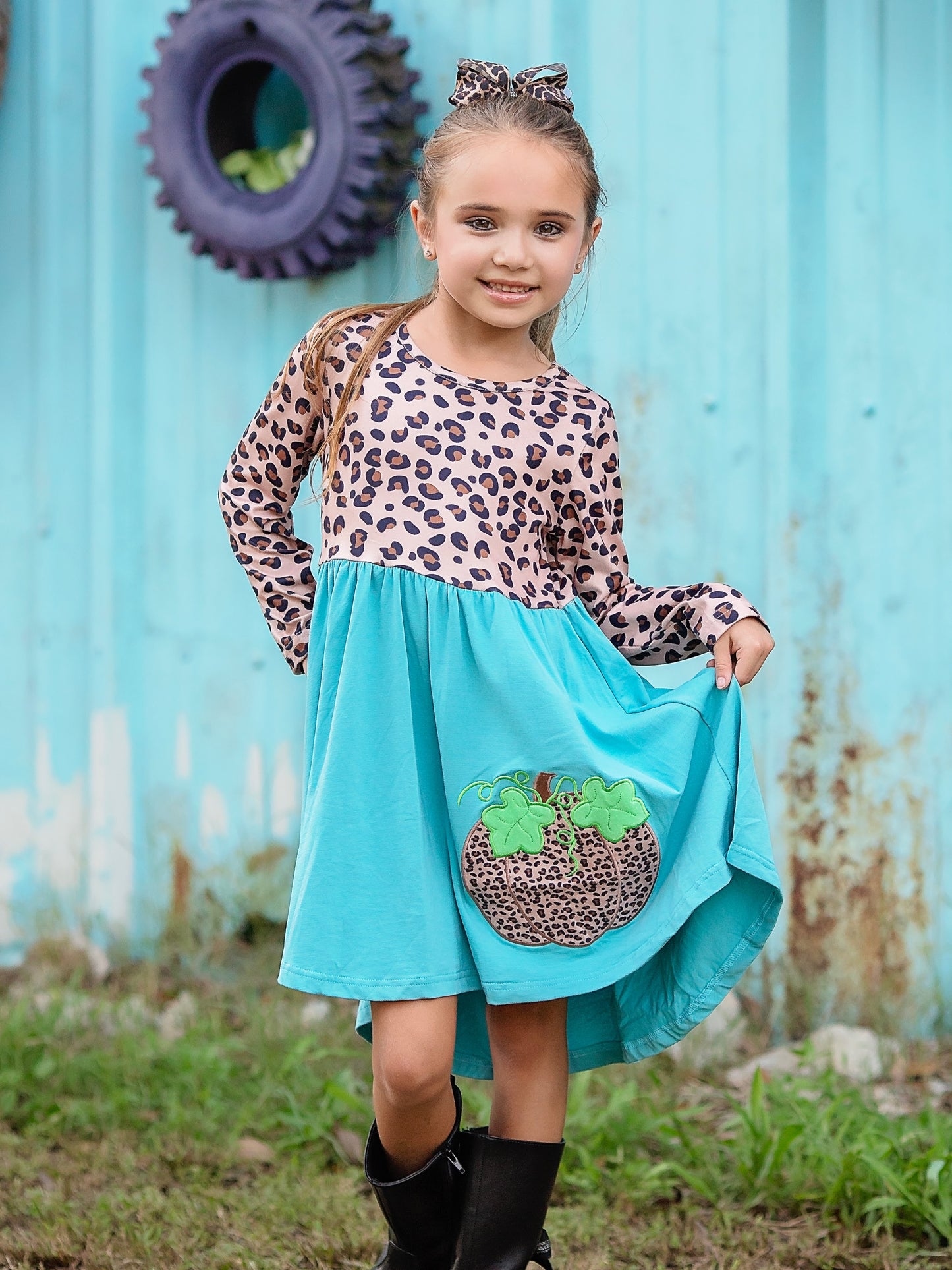 Turquoise & Animal Pumpkin Twirl Dress on a model