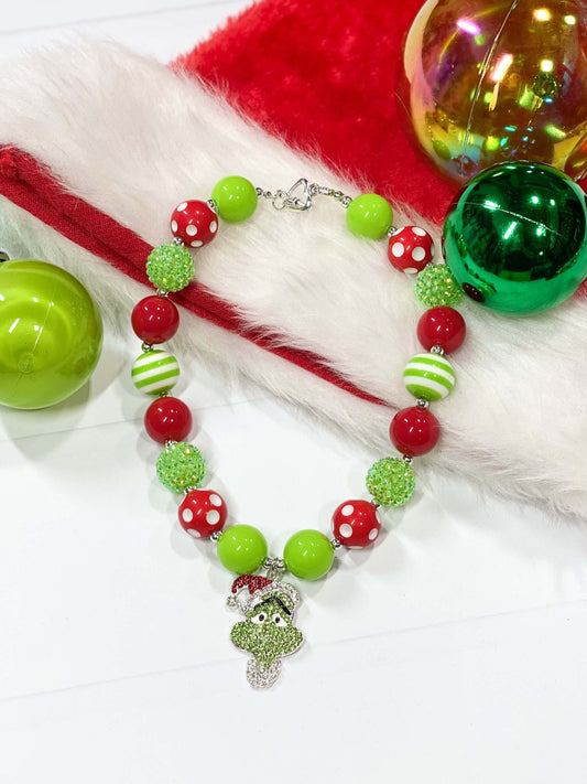 Rhinestone Grinch pendant chunky bead necklace with heart toggle closure.