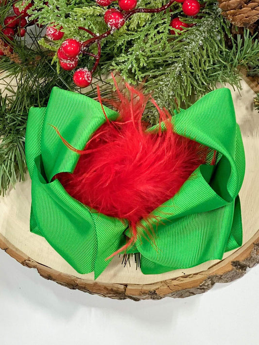 Kelly green grosgrain Texas-size hair bow with red ostrich puff center.