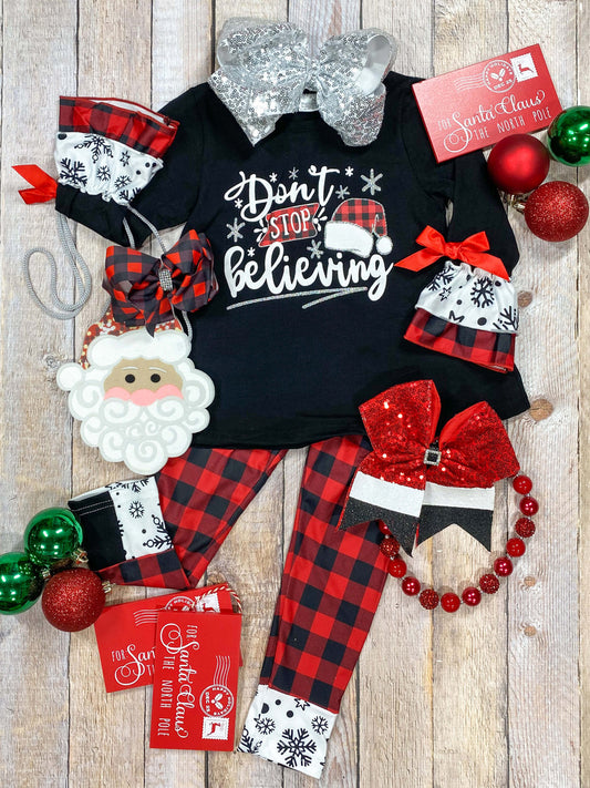 Don't stop believin' Santa red & black buffalo plaid legging set. This outfit has adorable ruffles sleeves with satin bows!