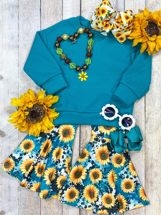 Turquoise long sleeve sweater with sunflower printed bell bottoms.