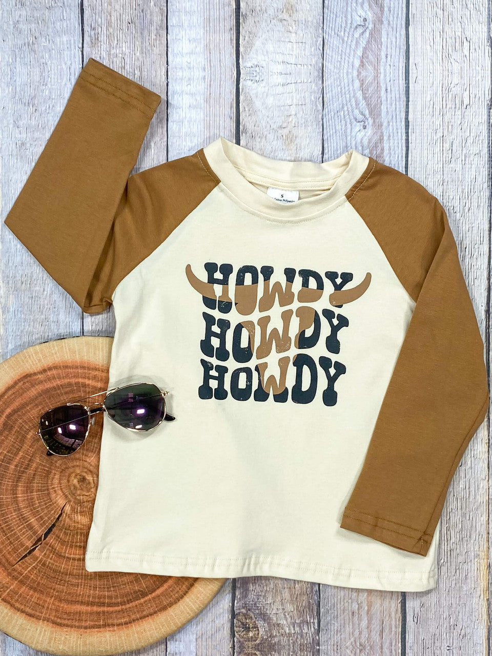 Tan raglan-sleeve style longhorn Howdy sweater