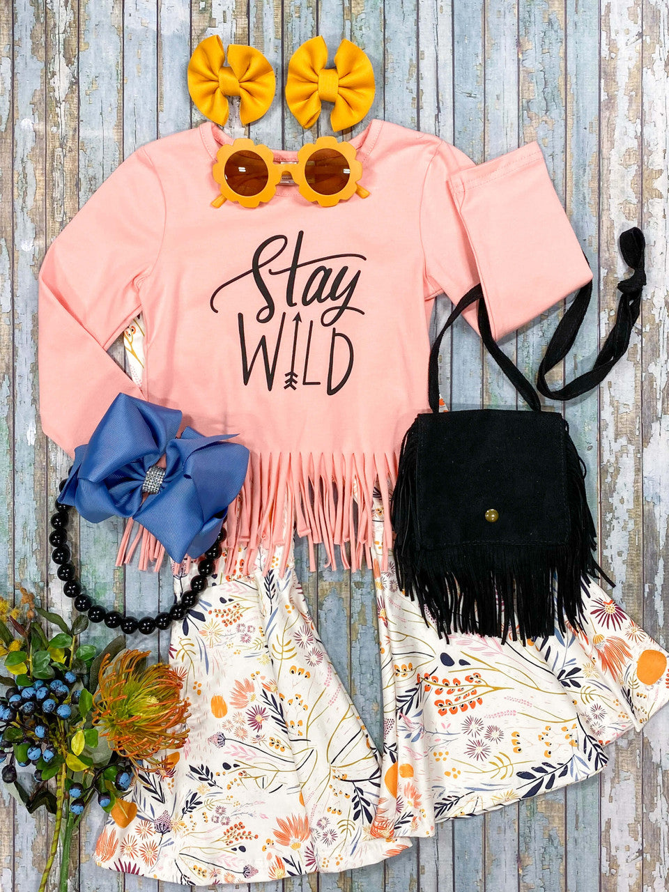 Stay Wild long sleeve fringe top with floral print bell bottoms. 