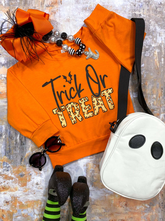 orange top with trick or treat and animal print 