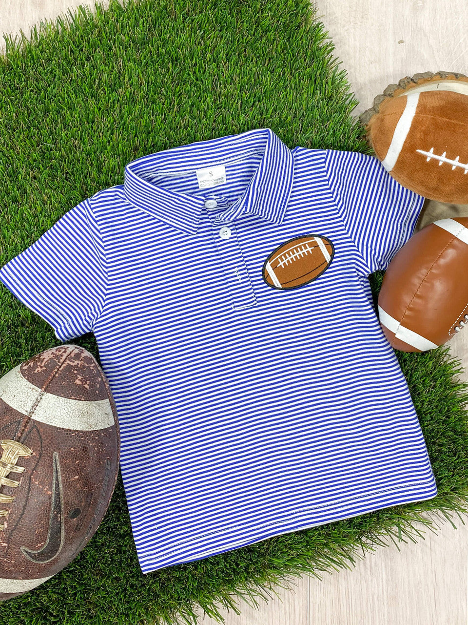 Blue and white striped collared shirt with small football applique design