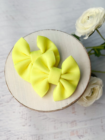 neon yellow puff pigtail bows