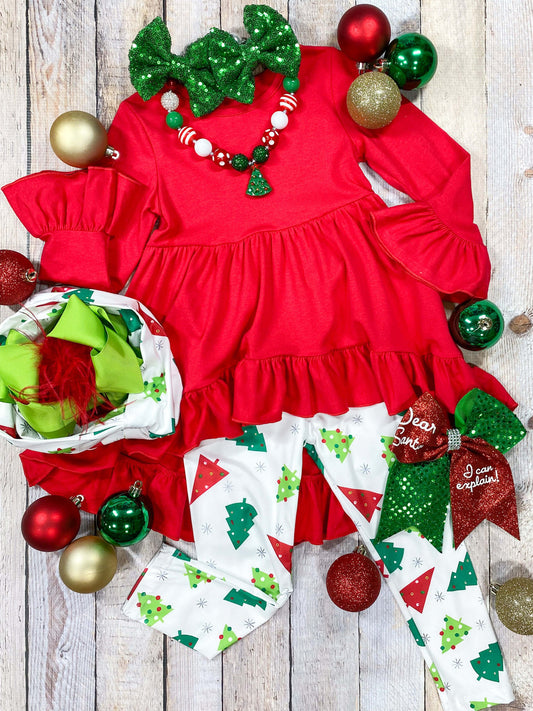 Red tunic top with tree-covered pants and a matching scarf.