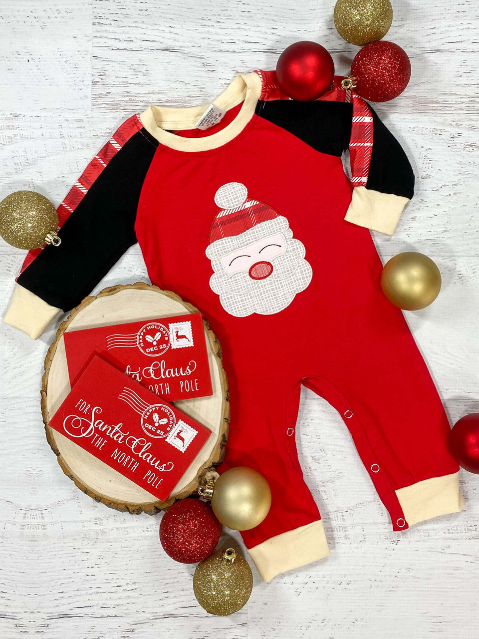 Long sleeve romper in red with a Santa applique and black sleeves