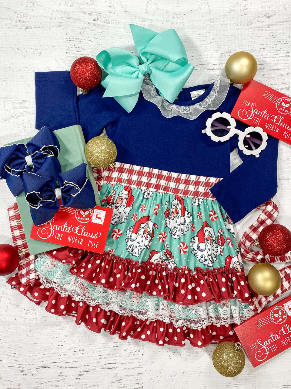 Long sleeve ruffled dress in Navy with a turquoise vintage Santa fabric on the skirt.