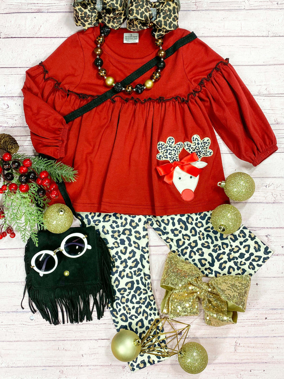 Red reindeer top paired with animal print leggings