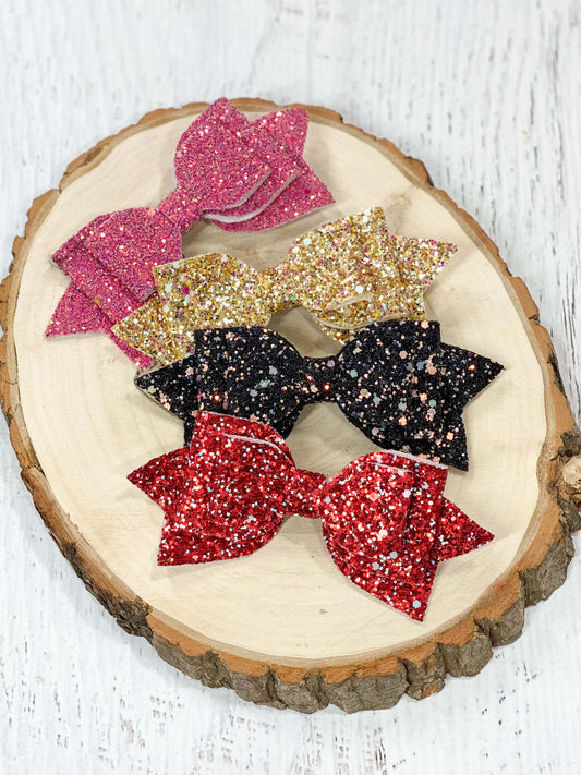 Glittery bow clippies in 4 color options