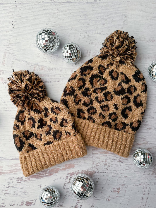 Matching mommy & me animal print beanies with a top knot 