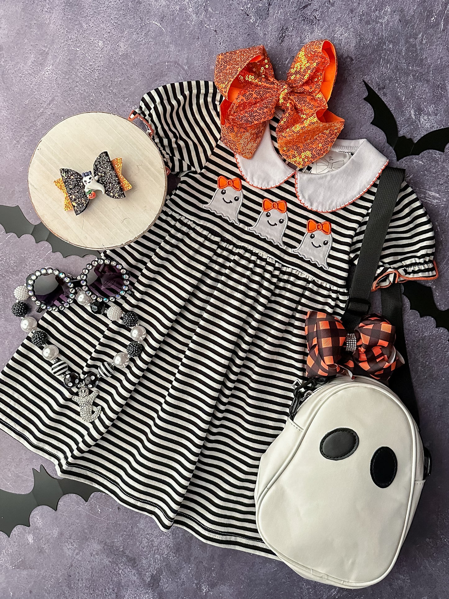 Collared black & white striped dress with orange piping and a ghost trio appliqué. 