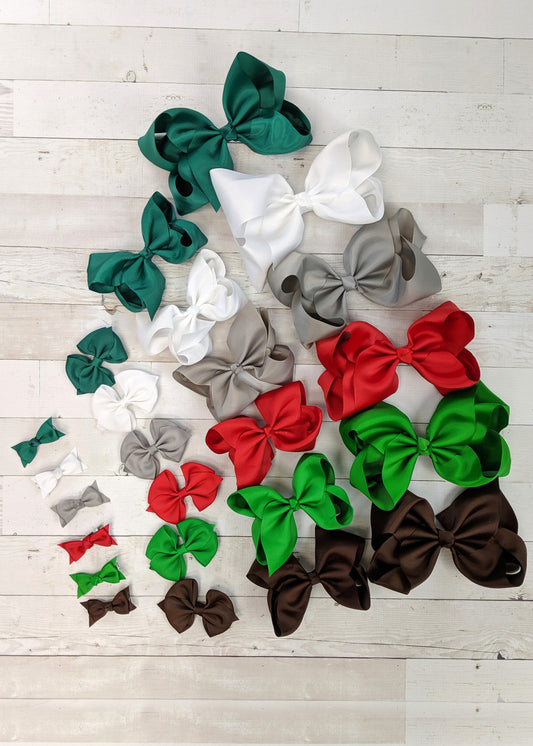 Winter Holidays bow sets in your choice of size; each set includes Red, Kelly Green, White, Hunter Green, Silver, and Chocolate solid color bows in the size of you choice. Each bow has an alligator clip backing.