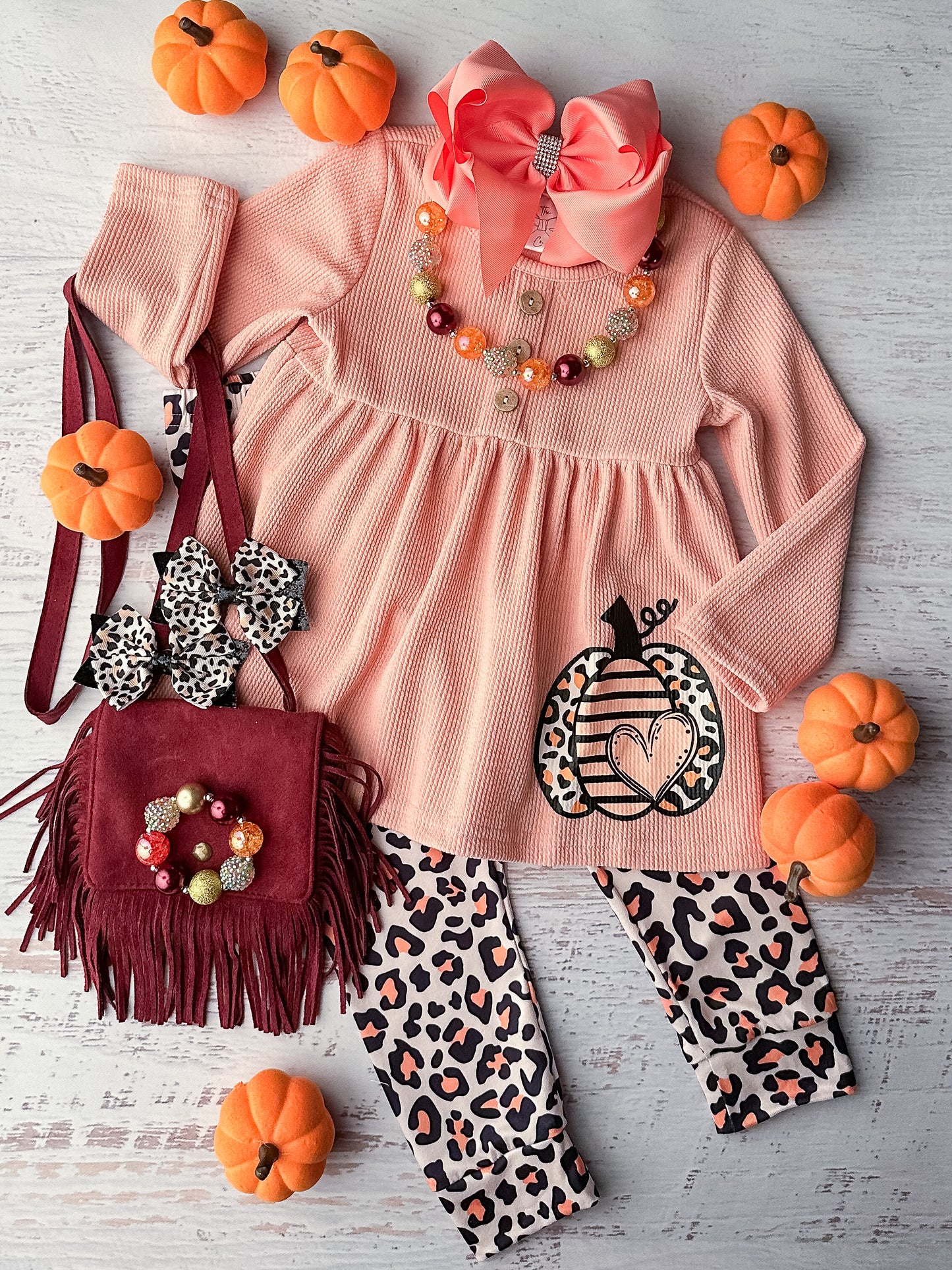 Long sleeve pink babydoll top with pumpkin design and matching leopard leggings