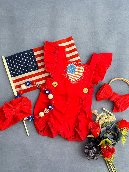 red baby romper with heart flag and ruffles
