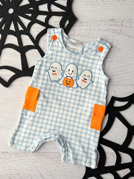 Blue gingham sleeveless romper with orange pockets and ghost trio appliqué. 