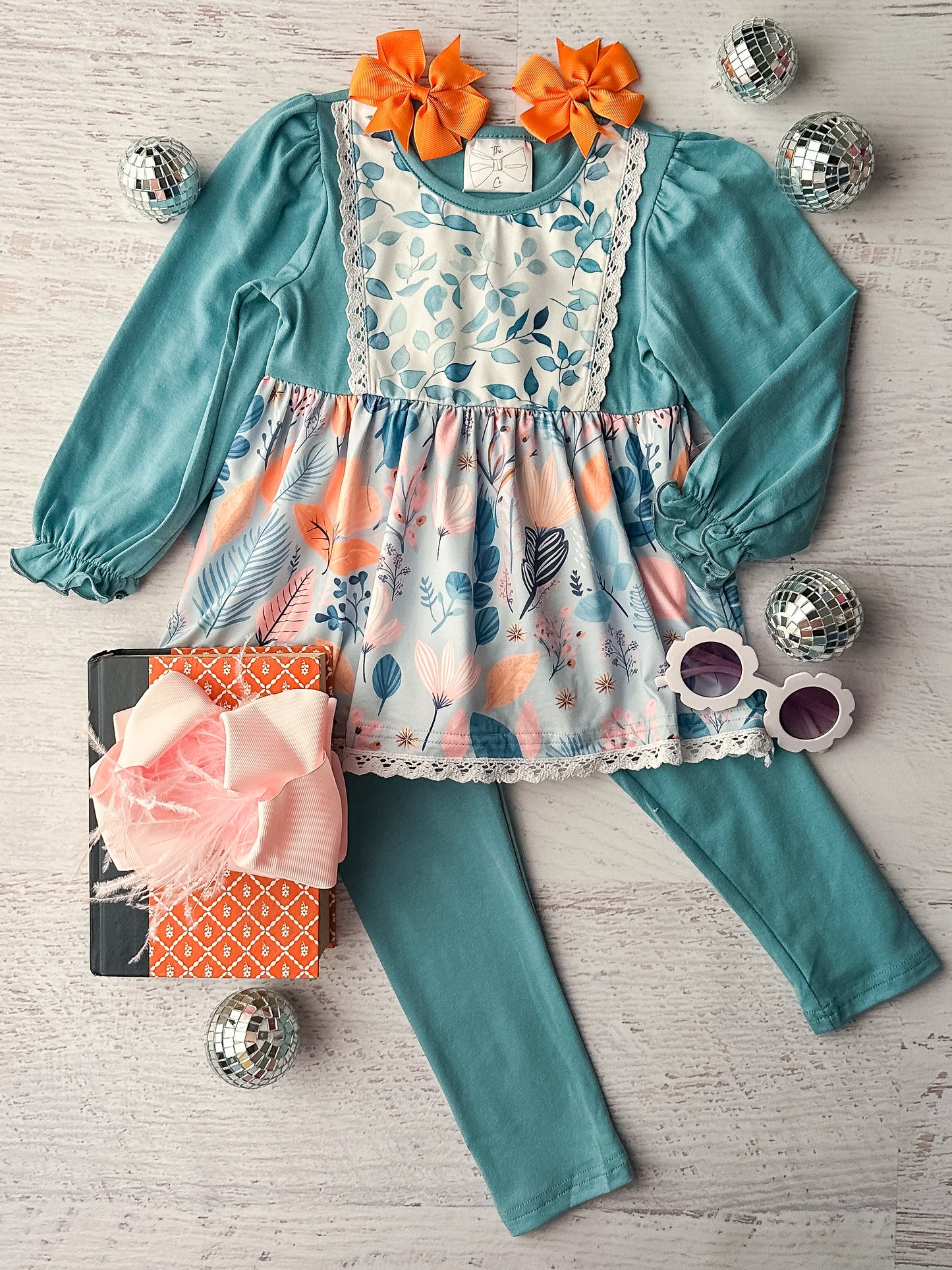 Long sleeve tunic top and leggings set in a teal color and a floral watercolor print.