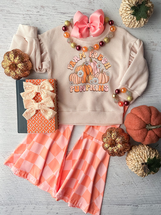 Long sleeve waffle knit tan top with Farm Fresh Pumpkins design with coordinating pink and orange checkered bell bottoms.